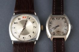 A selection of two wristwatches having manual wind movements and sterling silver cases.