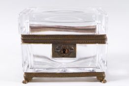 A French nineteenth century cut glass and ormulu rectangular casket on lion paw feet,