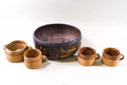 Three Studio pottery mugs and a matching milk jug together with a Studio pottery bowl.