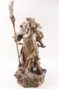 A brass figure of a Chinese warrior with five flags, holding a sword and a staff,