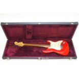 A Squire Strat electric guitar by Fender,