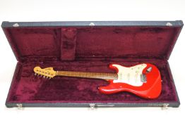 A Squire Strat electric guitar by Fender,