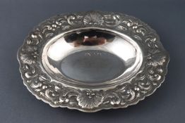 A silver bon bon dish of oval form, the edge chased with shells and scrollwork, by Walker and Hall,