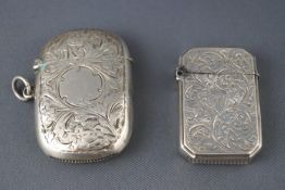 A silver vesta case with foliate engraving, Birmingham 1901 and another,