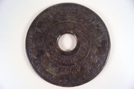 A Chinese green stone disc, carved with the Chinese Zodiac signs,