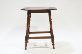 An Edwardian mahogany occasional table, the top inlaid with fruiting branches on turned legs,