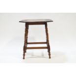 An Edwardian mahogany occasional table, the top inlaid with fruiting branches on turned legs,