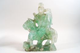 A Chinese carved simulated jade figure on horseback,