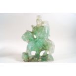 A Chinese carved simulated jade figure on horseback,