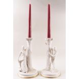 A pair of Franklin Mint porcelain candlesticks,