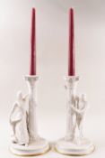 A pair of Franklin Mint porcelain candlesticks,