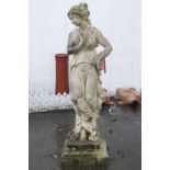 A composite stone garden statue in the form of a classical maiden on square plinth,