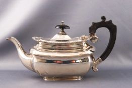 A silver bachelor teapot of belled rectangular form with gadrooned edge, ebony handle and knop,