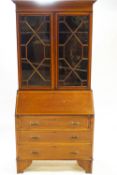 An Edwardian inlaid mahogany bureau book case with two astragal glazed doors under a plain frieze