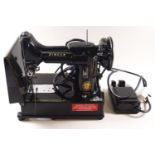 A Singer sewing machine, model 222K,