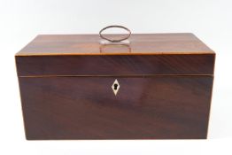 A Regency mahogany tea caddy with boxwood string inlay, with silver plated ring handle,