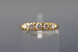 A yellow metal five stone graduated diamond ring. Approx 0.40ct Stamped 18ct.