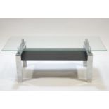 A rectangular glass and chrome coffee table,