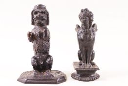 A Victorian cast iron figure of a dog begging and another of a sphinx