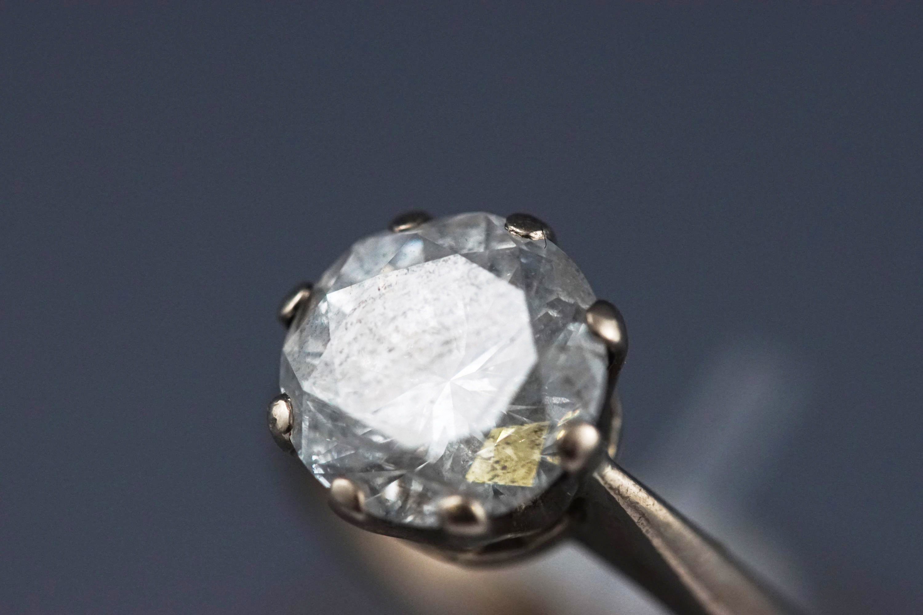 A white metal single stone diamond ring. - Image 7 of 13