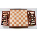 A Robert Burke Chess set, in a chess board box with two drawers,