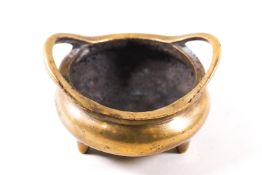 A Chinese polished bronze small censor, bears seal mark,