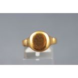 A yellow metal oval signet ring. Hallmarked 18ct gold, Chester.