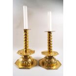 A pair of brass 17th century style candlesticks,