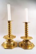 A pair of brass 17th century style candlesticks,