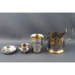 A Russian (?) gilt and Niello decorated pierced mug holder stamped 875, a Vodka cup....