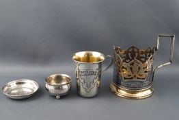 A Russian (?) gilt and Niello decorated pierced mug holder stamped 875, a Vodka cup....