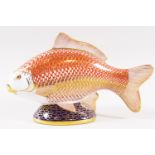 A Royal Crown Derby paper weight in the form of a fish with gold stopper,