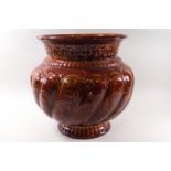 A large amber glazed Minton jardiniere planter, impressed and applied marks,