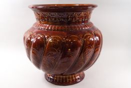 A large amber glazed Minton jardiniere planter, impressed and applied marks,