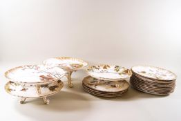 A Victorian Doulton porcelain dessert service, painted with birds among flowering plants,