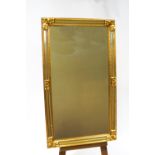 A 20th century mirror with gilt frame and mirrored panels,