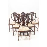 A set of six Sheraton style shield back mahogany dining chairs with Prince of Wales feather carved