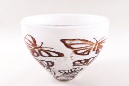 A Kosta Boda glass bowl decorated with butterflies on a white ground, etched factory marks,