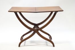 A 19th century mahogany coaching table with turned spindle supports,