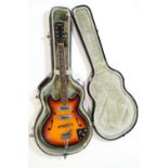 An Audition electric guitar, overall 97cm long,
