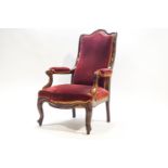 A Victorian mahogany show frame arm chair on cabriole legs
