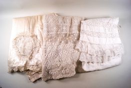 A lace over-skirt, bonnet,