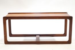 An A H McIntosh rectangular coffee table, the shaped legs linked by a stretcher,