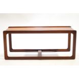 An A H McIntosh rectangular coffee table, the shaped legs linked by a stretcher,