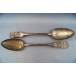 An unusual pair of metal fiddle pattern tablespoons,