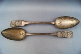 An unusual pair of metal fiddle pattern tablespoons,