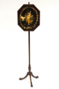 A 19th century mahogany and inlaid pole screen with an octagonal panel set a floral embroidery,