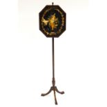A 19th century mahogany and inlaid pole screen with an octagonal panel set a floral embroidery,