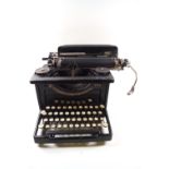 A 10" Smith and Corona typewriter with original cover