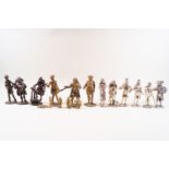 Twelve cast metal Dickens figures, patinated to simulate brass, chrome and bronze, 11cm and smaller,